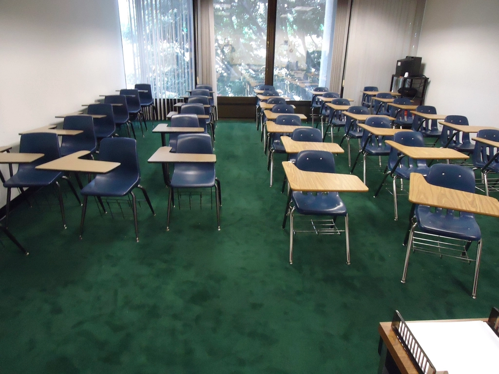 Classroom with rows of empty student desks