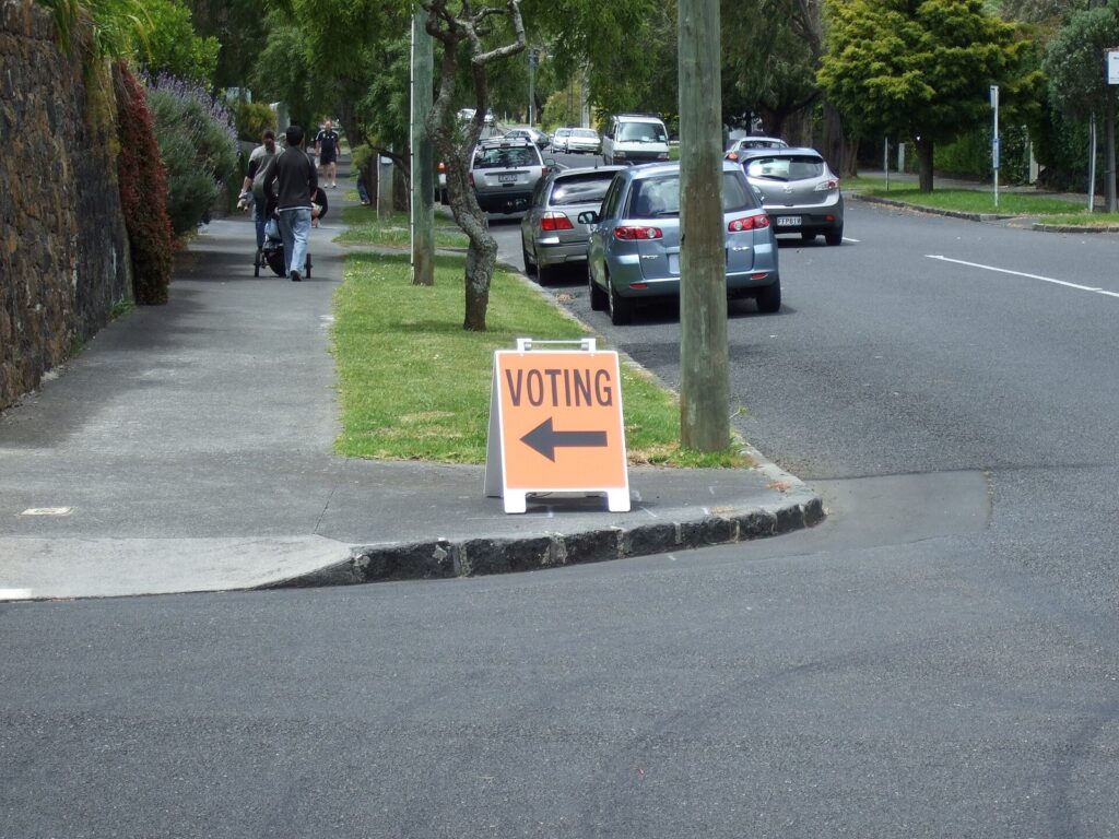 Voting sign pointing to a polling place